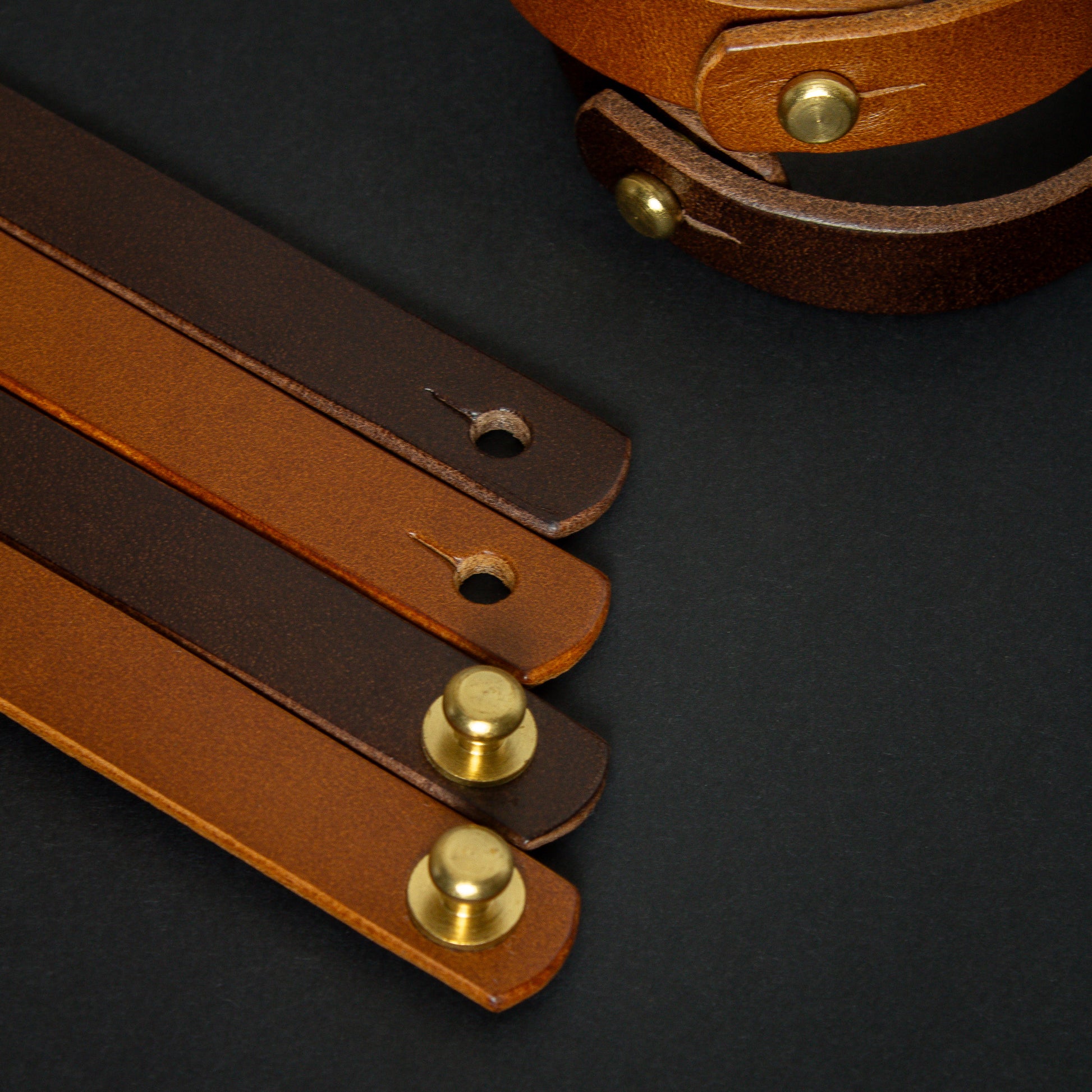 handmade leather wrist bands with solid brass sam browne studs - made from Buttero leather - close up fixings