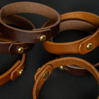 handmade leather wrist bands with solid brass sam browne studs - made from Buttero leather