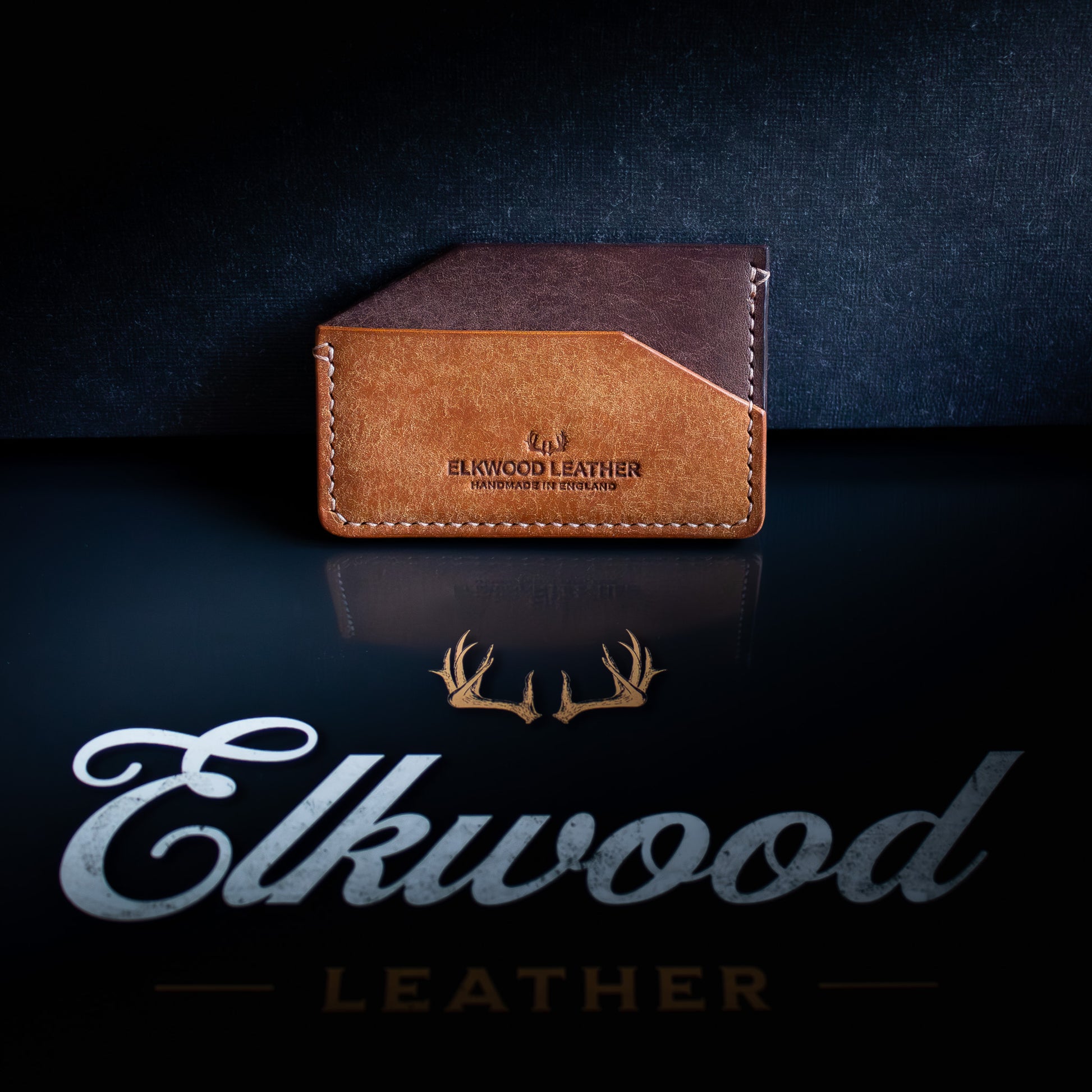 The Aspen - minimalist leather cardholder wallet on black Elkwood Leather logo