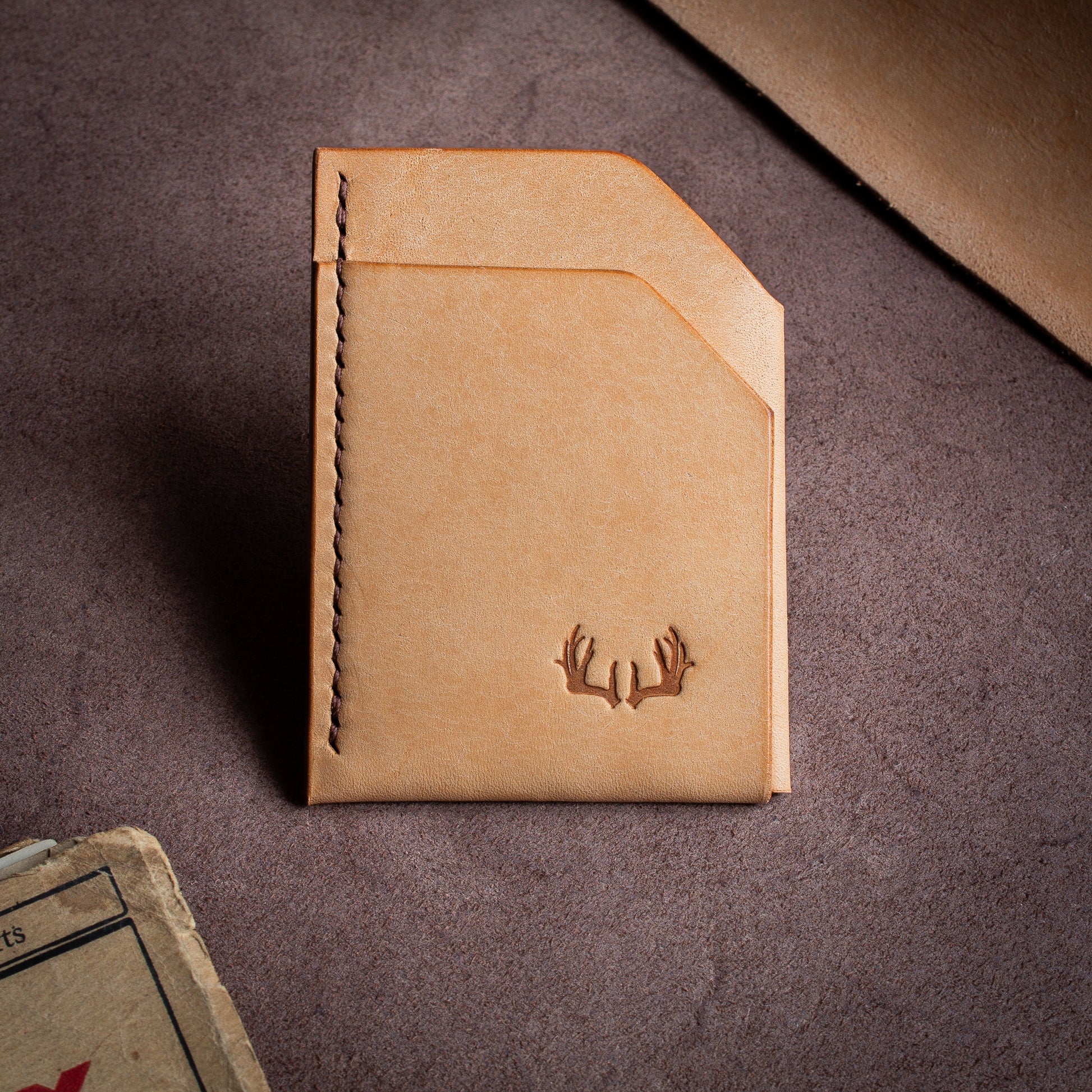 Folded handmade leather edc wallet with contrasting stitching made from Pueblo leather by Badalassi - Bone