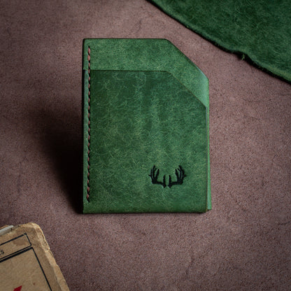 Folded handmade leather edc wallet with contrasting stitching made from Pueblo leather by Badalassi - Bottiglia