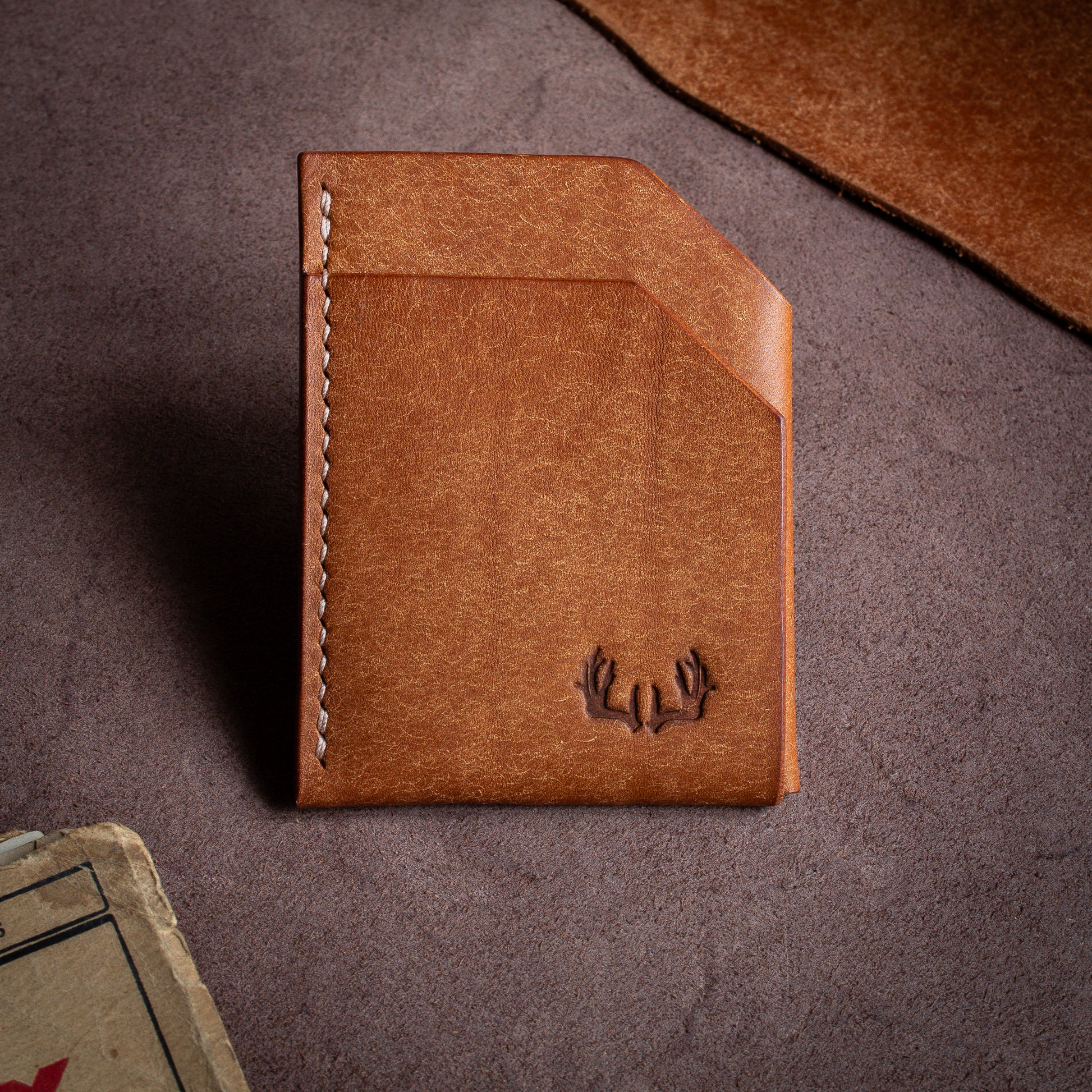 Folded handmade leather edc wallet with contrasting stitching made from Pueblo leather by Badalassi - Cognac