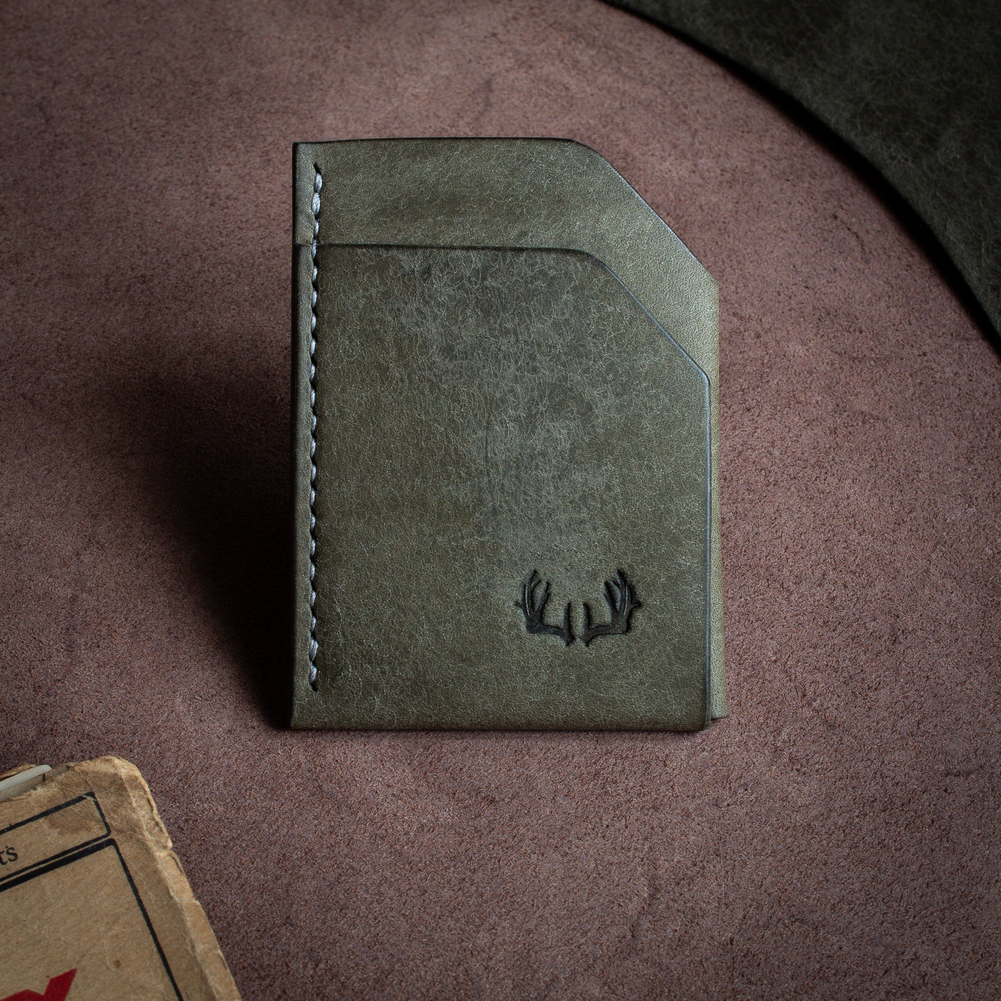 Folded handmade leather edc wallet with contrasting stitching made from Pueblo leather by Badalassi - Grigio