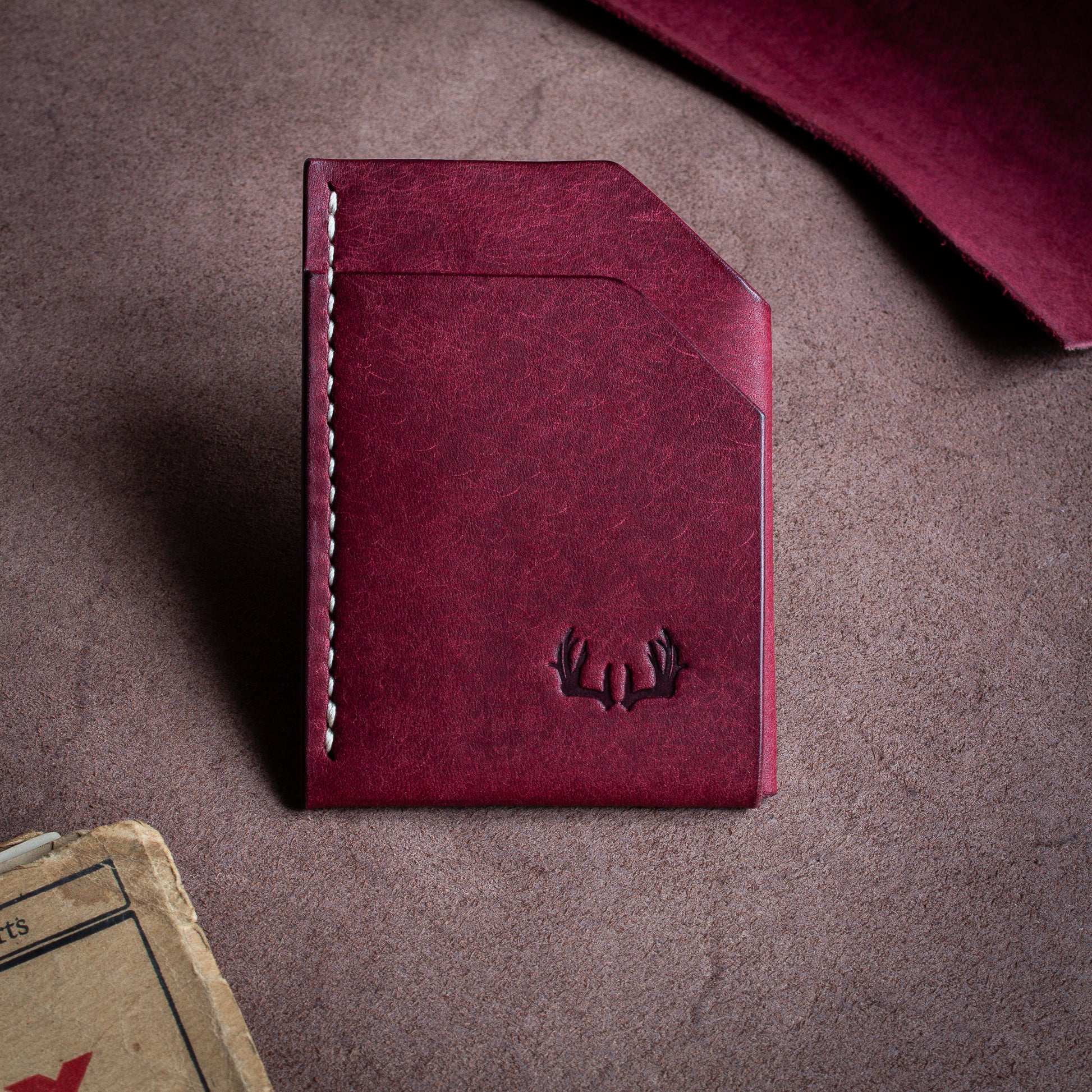 Folded handmade leather edc wallet with contrasting stitching made from Pueblo leather by Badalassi - Mosto