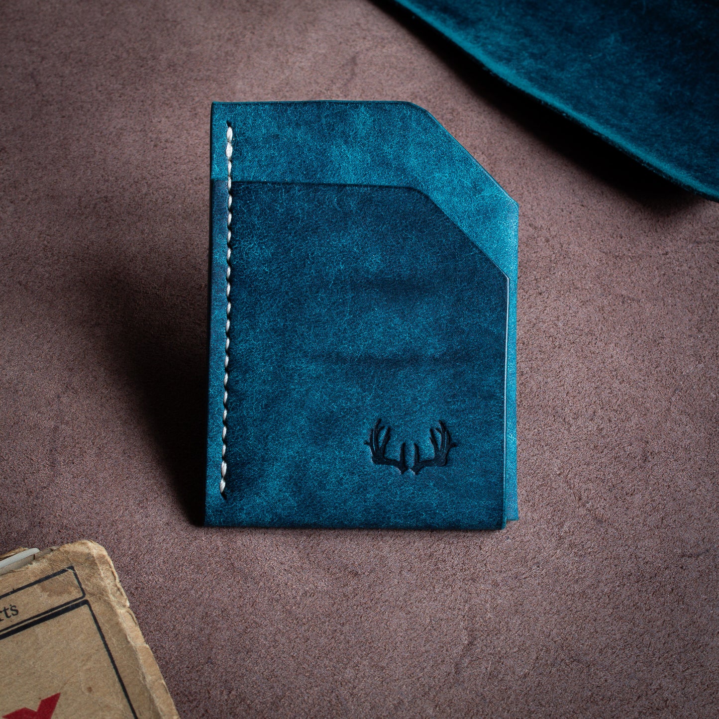 Folded handmade leather edc wallet with contrasting stitching made from Pueblo leather by Badalassi - Nationale