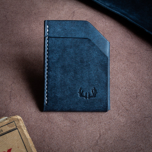 Folded handmade leather edc wallet with contrasting stitching made from Pueblo leather by Badalassi - Navy