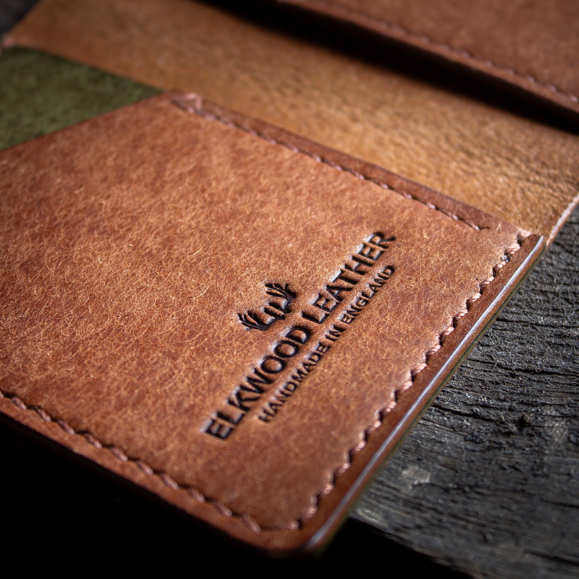 Brown leather wallet stitching close up