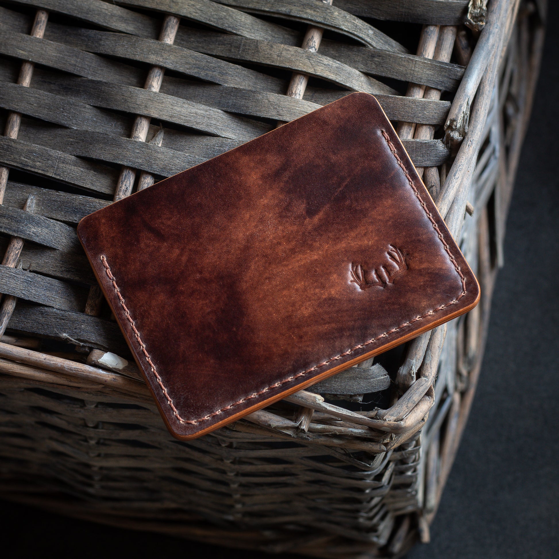 reverse shell cordovan leather wallet - brown museum Rocado shell cordovan leather onto of whicker basket reverse side